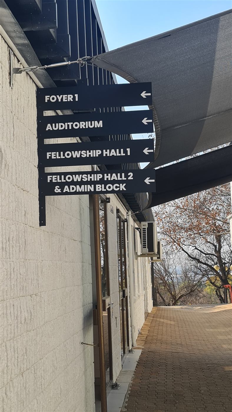 Directional wayfinding signage for Rhema Church auditorium and fellowship halls