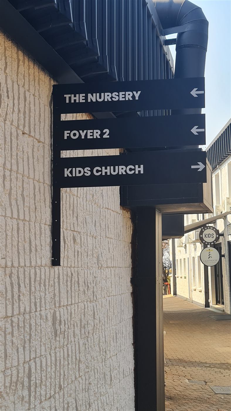 Directional wayfinding signage for Rhema Kids Church